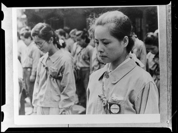 Girls Volunteer Squad member sheds tears while listening to Emperor Hirohito's declaration of surrender on August 15th