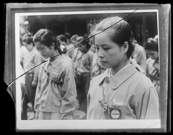 Girls Volunteer Squad member sheds tears while listening to Emperor Hirohito's declaration of surrender on August 15th