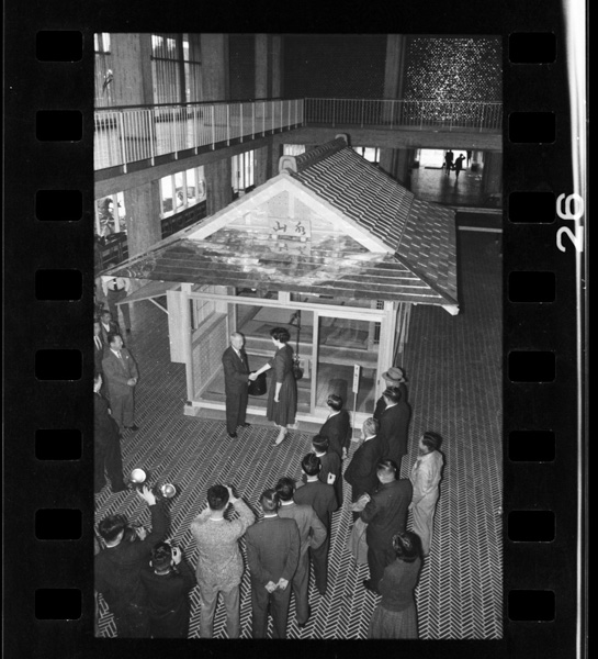 Mrs. Davis, representative of San Diego residents in Yokohama, receives a Japanese model tea house, a gift of Yokohama to San Diego
