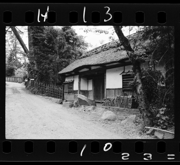 Old highway, with a dilapidated house